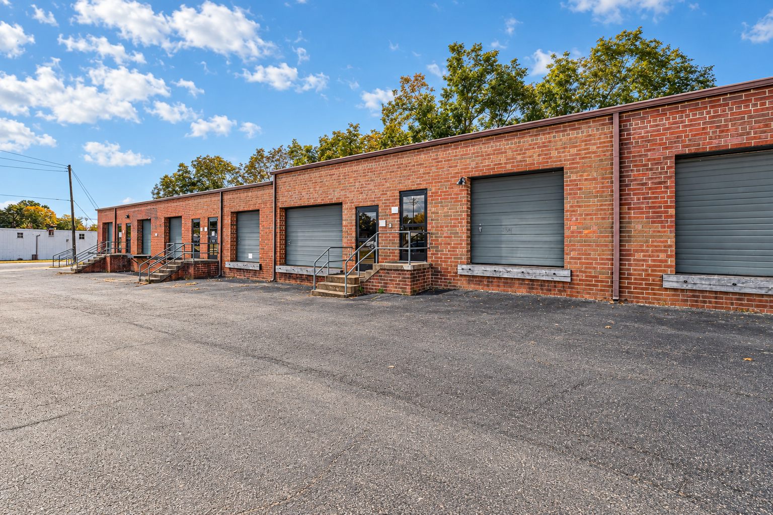 Brick small-bay industrial building with drive-in doors at 3240 Highland Avenue
