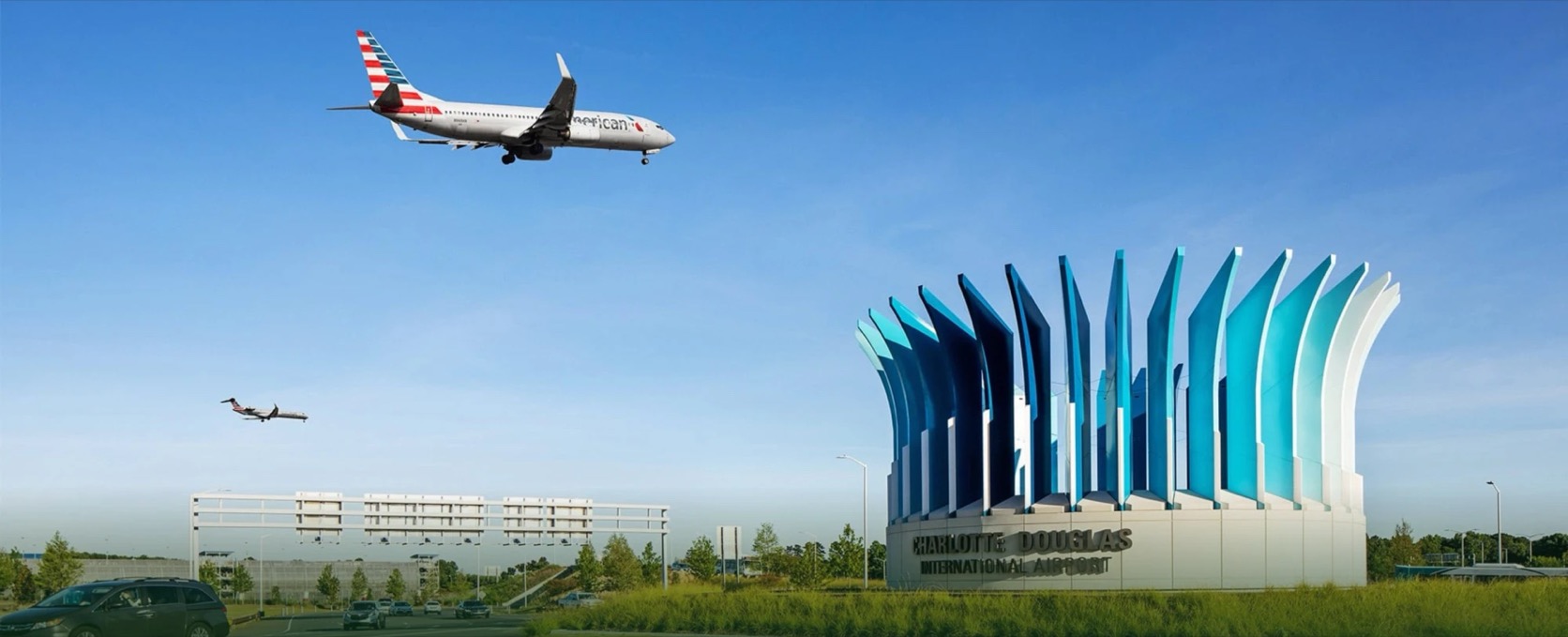 An American Airlines jet over the entrance sculpture at Charlotte Douglas International Airport