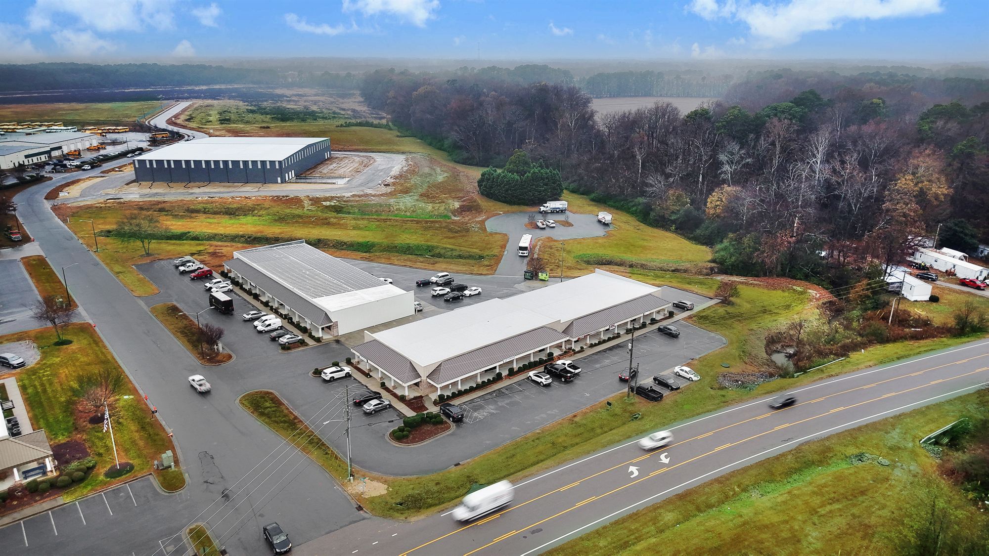 Aerial view of 1990 Allen Road, Greenville, North Carolina, showing the colonnaded front building along Allen Road and the flex building behind it, with striped parking between them