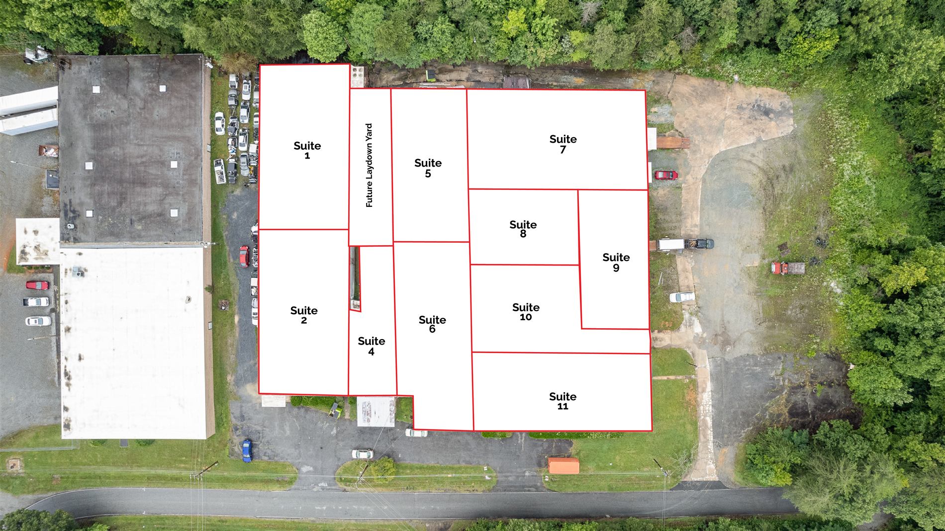Overhead suite plan of 314 Mandustry Street: each of the eleven suites drawn as a white block outlined in red and numbered one through eleven, with the future laydown yard labeled between the front and rear building sections and the outdoor storage yard to the east
