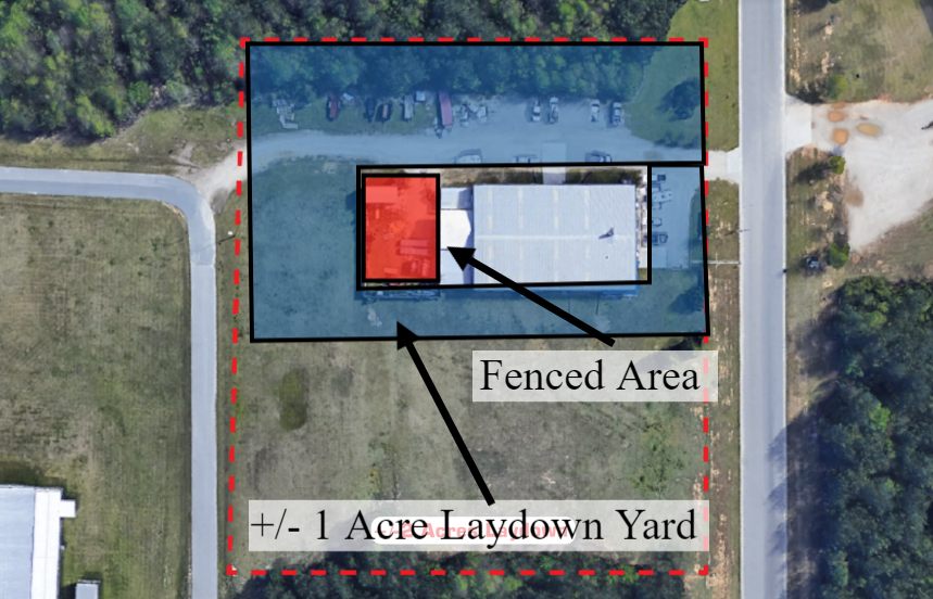 Aerial site map of 4475 Technology Drive NW with a dashed outline around the parcel, the building near its center, a shaded fenced area around the building, and a label marking the +/-1 acre laydown yard